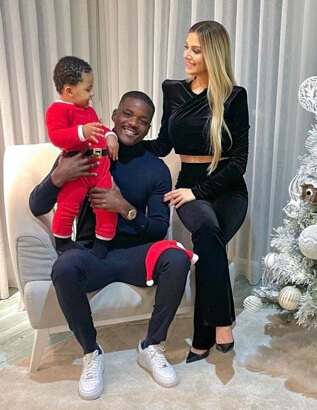 William Carvalho with his partner and son.